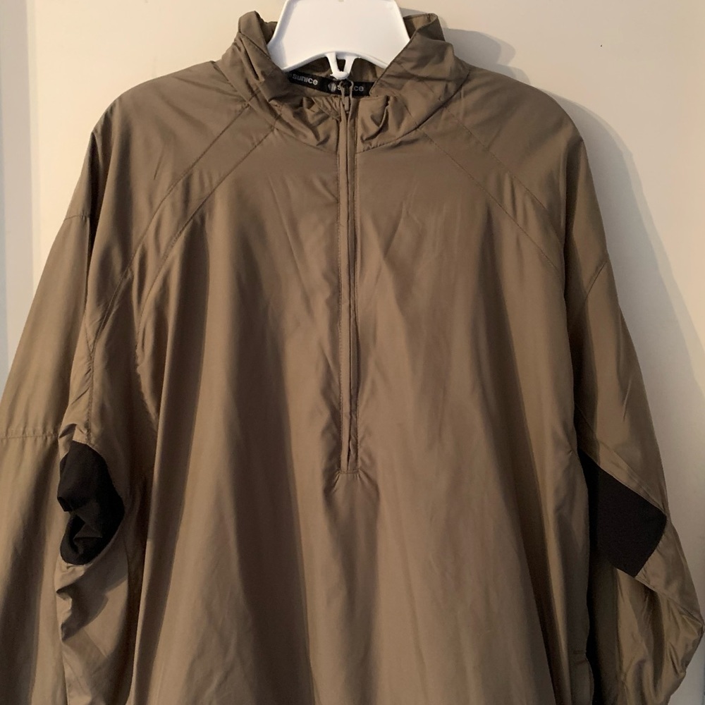 Men’s tan/black 1/4 zip Sunice lightweight windbreaker.